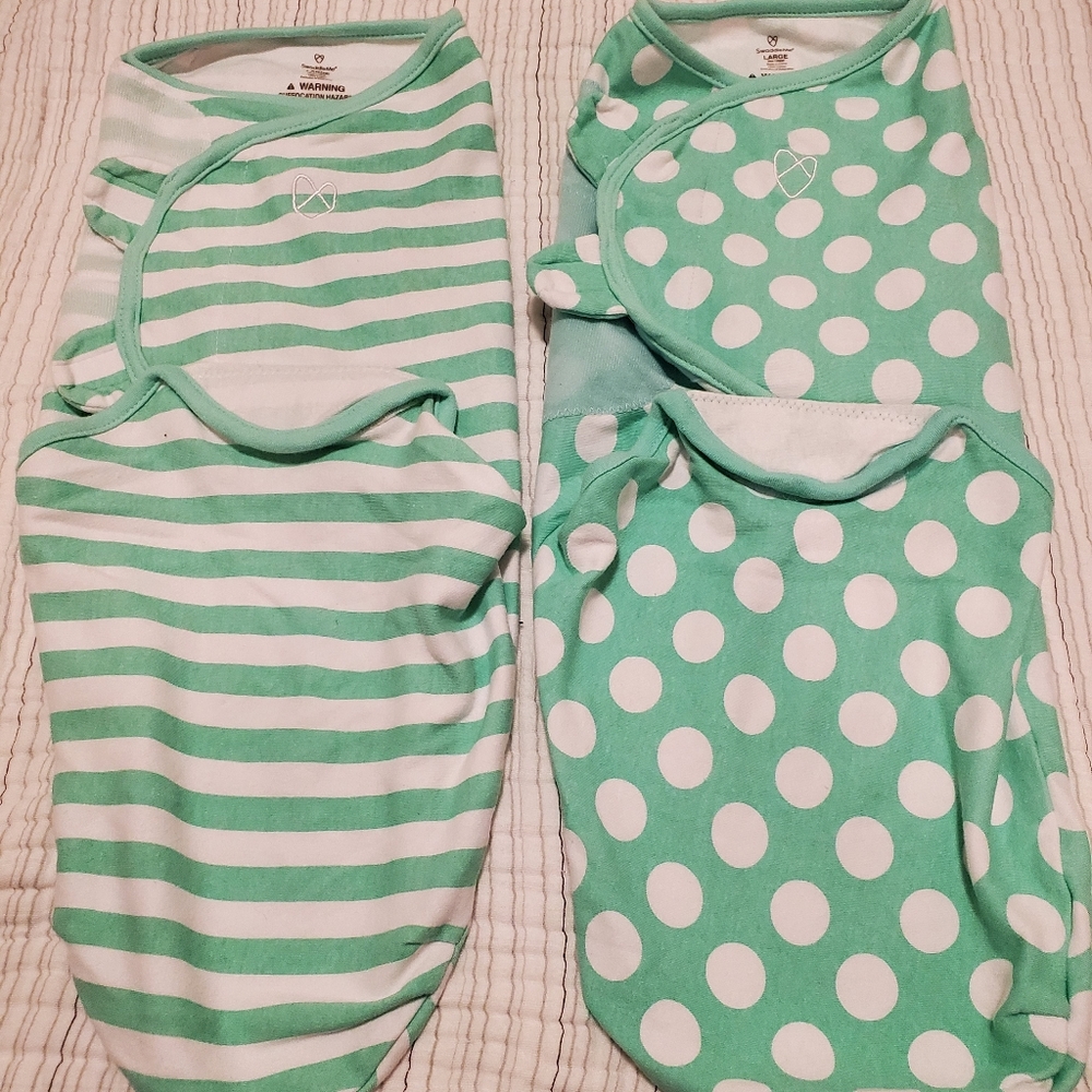 Set of SwaddleMe swaddles.